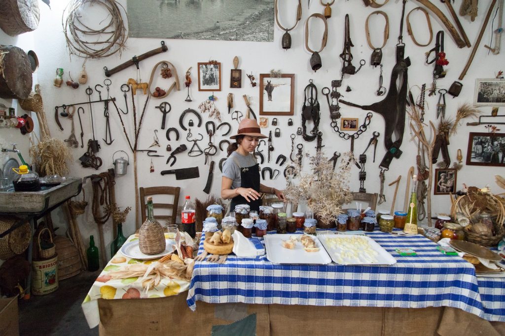 Your Tuscan Sunflower in traditional garb, inspects the wares in la Casetta del Pastore in Frosolone